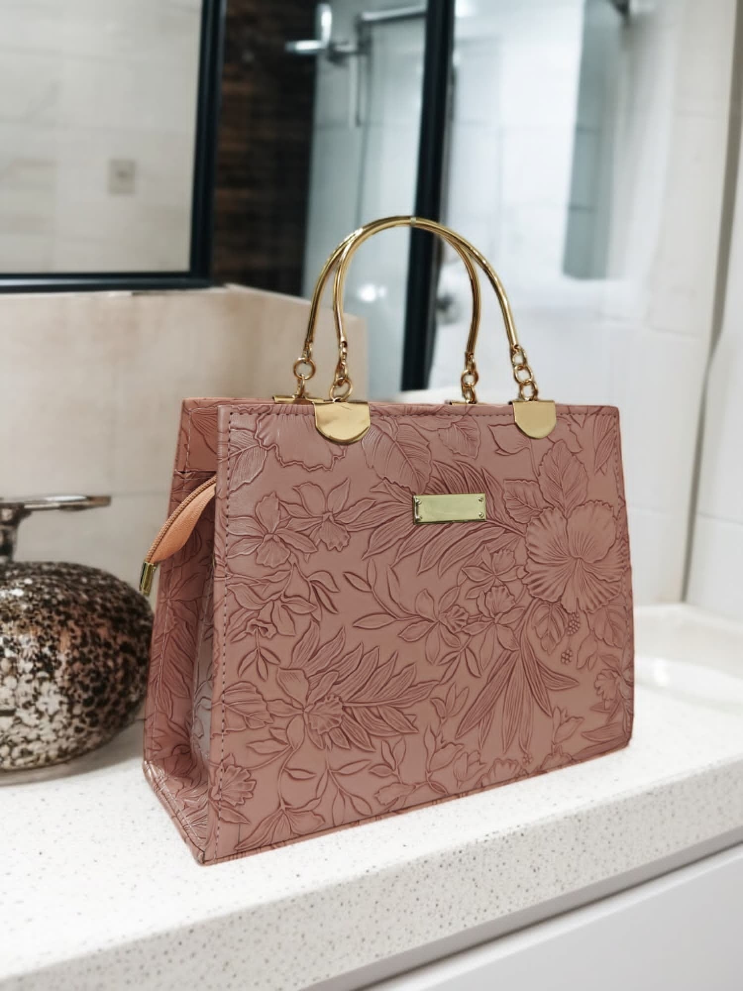 Elegant Black Floral Embossed Handbag with Gold Accents