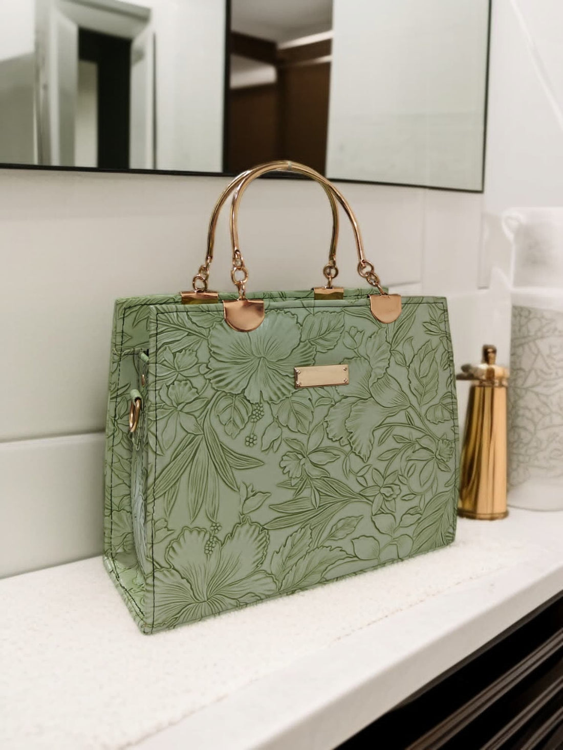 Elegant Black Floral Embossed Handbag with Gold Accents
